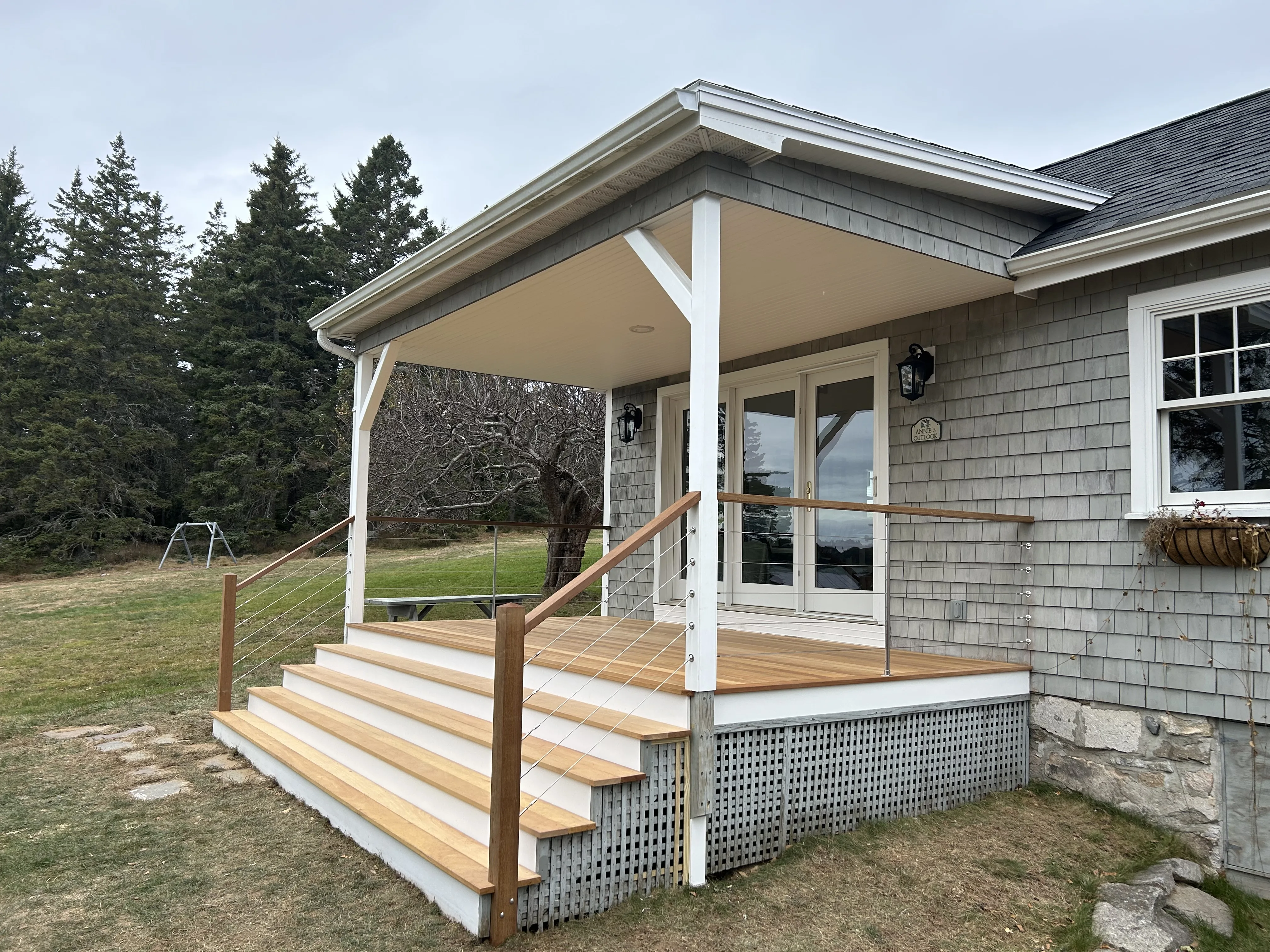 Bass Harbor porch restoration with Garapa hardwood deck, coastal Maine